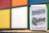 A bag of Chromatic Coffee Co. Gamut coffee placed in front of a colorful background.