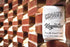 A pack of Chromatic Coffee Co. Keynote coffee, with the brand name and product description visible, placed against a brick wall background.